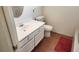 Bathroom featuring white vanity with a single sink and toilet at 4285 El Como Way, Las Vegas, NV 89121