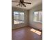 Bedroom featuring two windows and tile flooring at 4285 El Como Way, Las Vegas, NV 89121