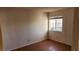 Cozy bedroom featuring tile flooring and a window for natural light at 4285 El Como Way, Las Vegas, NV 89121