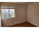 Bedroom featuring tiled floors and a window with neighborhood view at 4285 El Como Way, Las Vegas, NV 89121