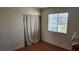 Cozy bedroom with natural light features a window and closet with a curtain at 4285 El Como Way, Las Vegas, NV 89121