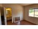 Bedroom with tile floors, natural light, and attached bathroom at 4285 El Como Way, Las Vegas, NV 89121