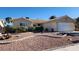 Single story home featuring desert landscaping with gravel, stone accents, and shrubs at 4285 El Como Way, Las Vegas, NV 89121