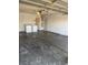 Unfinished garage interior with washer and dryer hookups at 4285 El Como Way, Las Vegas, NV 89121