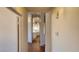 Neutral hallway leading to the kitchen with tile floors at 4285 El Como Way, Las Vegas, NV 89121