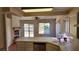 Bright and airy kitchen with stainless steel appliances and tile countertops at 4285 El Como Way, Las Vegas, NV 89121