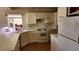 Bright kitchen with white appliances, a corner sink, and ample counter space, enhancing functionality and appeal at 4285 El Como Way, Las Vegas, NV 89121