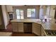 Spacious kitchen with a large island, stainless steel dishwasher, and tile countertops offers ample workspace at 4285 El Como Way, Las Vegas, NV 89121