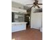 Open layout kitchen with tile floors and breakfast bar area at 4285 El Como Way, Las Vegas, NV 89121