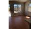 Spacious living room featuring tile floors, large windows and back yard access at 4285 El Como Way, Las Vegas, NV 89121