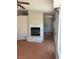 Living room with a fireplace, tile floors, and a ceiling fan at 4285 El Como Way, Las Vegas, NV 89121