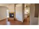 Living room showcasing a fireplace, an open floor plan and seamless connectivity to the adjacent kitchen space at 4285 El Como Way, Las Vegas, NV 89121