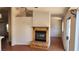 A cozy living room features a fireplace with a hearth, adding warmth and character to the space at 4285 El Como Way, Las Vegas, NV 89121