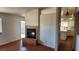 Cozy living room featuring a fireplace, neutral walls, and a pass through to the kitchen at 4285 El Como Way, Las Vegas, NV 89121