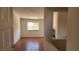 View of the light-filled living room showing the tile floor and large windows at 4285 El Como Way, Las Vegas, NV 89121