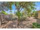 Backyard with mature trees and plants providing a tranquil setting at 4552 Largo Cantata St, Las Vegas, NV 89135