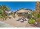 Attractive single-story home featuring a large driveway, two-car garage, and low-maintenance landscaping at 4552 Largo Cantata St, Las Vegas, NV 89135