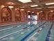 Luxurious indoor pool with decorative lighting and painted arches, ideal for year-round enjoyment at 4552 Largo Cantata St, Las Vegas, NV 89135