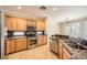 Well-equipped kitchen with stainless steel appliances, granite countertops, and ample cabinet space at 4552 Largo Cantata St, Las Vegas, NV 89135