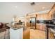 Bright kitchen with stainless steel appliances, granite countertops, and a breakfast bar at 4552 Largo Cantata St, Las Vegas, NV 89135