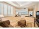Cozy living room featuring neutral colors, plantation shutters, and decorative rug at 4552 Largo Cantata St, Las Vegas, NV 89135