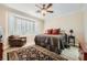 Cozy main bedroom with bay windows, tile flooring, and neutral decor creates a relaxing retreat at 4552 Largo Cantata St, Las Vegas, NV 89135