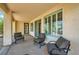 Covered patio features comfortable seating and outdoor access at 4552 Largo Cantata St, Las Vegas, NV 89135