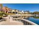 Scenic view of the community's tranquil pond, reflecting the surrounding buildings and blue sky at 4552 Largo Cantata St, Las Vegas, NV 89135