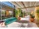 Covered walkway with potted plants and seating, perfect for a relaxing stroll through the community at 4552 Largo Cantata St, Las Vegas, NV 89135
