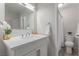 Updated bathroom with a white vanity, quartz counters, and modern fixtures at 4745 Madrigal Way, Las Vegas, NV 89122