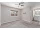Bedroom with ensuite bathroom featuring carpet and neutral paint at 4745 Madrigal Way, Las Vegas, NV 89122