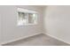 Neutral bedroom with carpet, a window and white trim throughout at 4745 Madrigal Way, Las Vegas, NV 89122