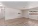 Modern living room with sleek flooring, neutral walls, and a large window at 4745 Madrigal Way, Las Vegas, NV 89122