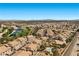 Great aerial view of a housing development featuring a community pool, landscaping and mountain views at 4821 Black Bear Rd # 101, Las Vegas, NV 89149