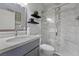 Bright bathroom with solid surface counters, modern fixtures, and a glass-enclosed shower at 4821 Black Bear Rd # 101, Las Vegas, NV 89149