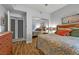 This bright bedroom features wood flooring, a mirrored closet, and ample natural light at 4821 Black Bear Rd # 101, Las Vegas, NV 89149
