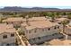 Townhome exterior highlighting private garages, and a lush landscaped community at 4821 Black Bear Rd # 101, Las Vegas, NV 89149