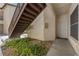 Exterior door of condo unit with staircase access and easy entry to the Painted Desert community at 4821 Black Bear Rd # 101, Las Vegas, NV 89149