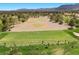 Golf course putting green with players and scenic views at 4821 Black Bear Rd # 101, Las Vegas, NV 89149