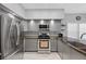 Well-equipped kitchen featuring stainless steel appliances, granite countertops and ample lighting at 4821 Black Bear Rd # 101, Las Vegas, NV 89149
