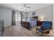 Comfortable main bedroom featuring hardwood floors, a ceiling fan, and large windows with plantation shutters at 4821 Black Bear Rd # 101, Las Vegas, NV 89149