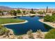 Scenic view of a lush community pond and its surrounding landscape of the Painted Desert golf course in Las Vegas at 4821 Black Bear Rd # 101, Las Vegas, NV 89149