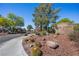 Entrance to the Painted Desert community with desert landscaping and rock formations at 4821 Black Bear Rd # 101, Las Vegas, NV 89149