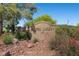 Entrance to the Painted Desert community with desert landscaping and rock formations at 4821 Black Bear Rd # 101, Las Vegas, NV 89149