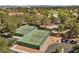 Aerial view of two tennis courts with green fencing and nearby parking at 4821 Black Bear Rd # 101, Las Vegas, NV 89149