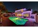 A backyard with a pool, hot tub, and covered patio, perfect for outdoor entertaining at 4835 Illustrious St, Las Vegas, NV 89147
