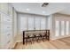 Light and bright dining area with custom bar and french doors to the backyard at 4835 Illustrious St, Las Vegas, NV 89147