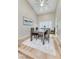 Elegant dining room with a wood table, seating for six, and natural light from a window at 4835 Illustrious St, Las Vegas, NV 89147