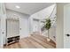 Inviting entryway with coat rack, ample natural light, and staircase to the second floor at 4835 Illustrious St, Las Vegas, NV 89147