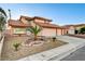 Inviting two-story home with three-car garage and xeriscaped front yard at 4835 Illustrious St, Las Vegas, NV 89147